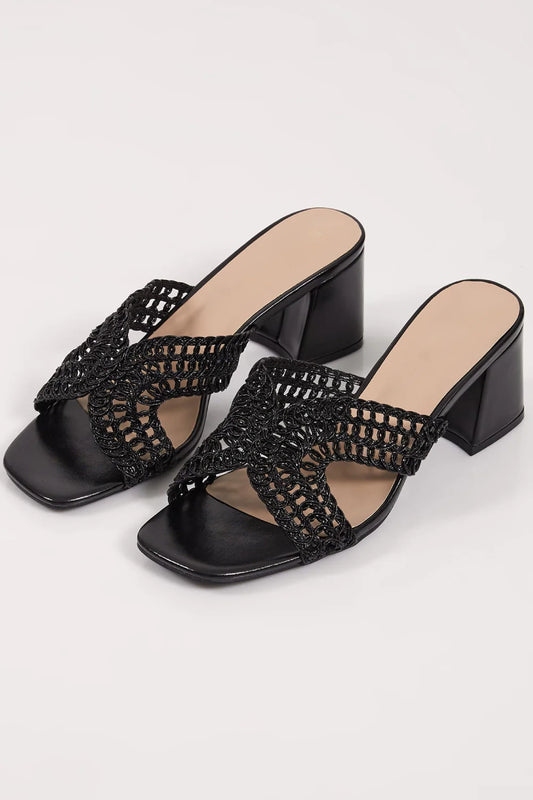 Front view of black knitted block heel mules, showcasing the unique knitted texture and stylish design, London fashion from DeepsLondon.