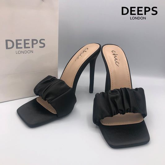 Close-up detail of Lily satin ruched mule slip-on heel in black, showcasing the luxurious satin and stylish ruched design, London style from DeepsLondon.