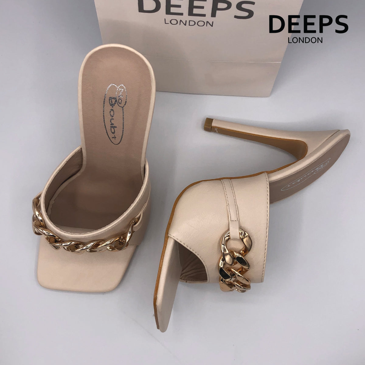 Front view of women's Zaki chain strap square toe stiletto heels in cream, edgy London style from DeepsLondon.