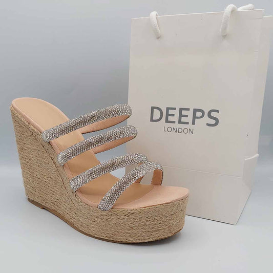 Front view of Bali open toe silver multi diamante tube strap raffia wedge sandals in nude, showcasing the comfortable wedge and sparkling diamante straps, London summer style from DeepsLondon.
