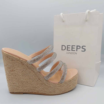 Side profile of Bali open toe silver multi diamante tube strap raffia wedge sandals in nude, highlighting the stylish wedge platform and sparkling strap design, London summer fashion from DeepsLondon.