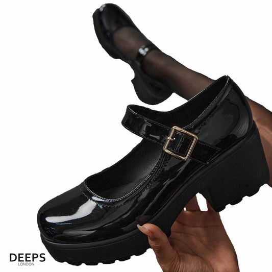 Woman's foot wearing stylish black chunky Mary Jane shoes, a versatile and comfortable choice for London life.