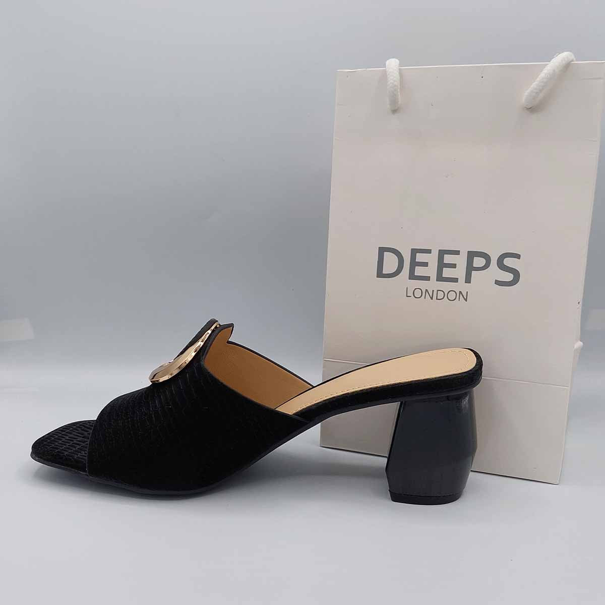 Woman's foot wearing stylish breezy block heel open toe mules in black, a comfortable and fashionable choice for London days from DeepsLondon.
