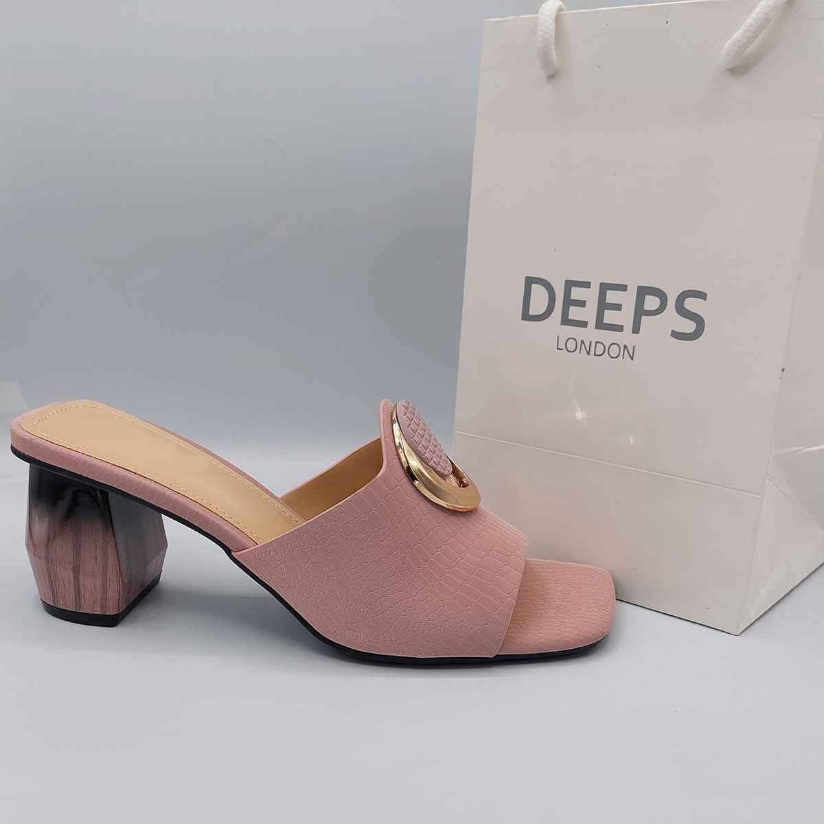 Woman's foot wearing stylish breezy block heel open toe mules in pink, a comfortable and fashionable choice for London days from DeepsLondon.