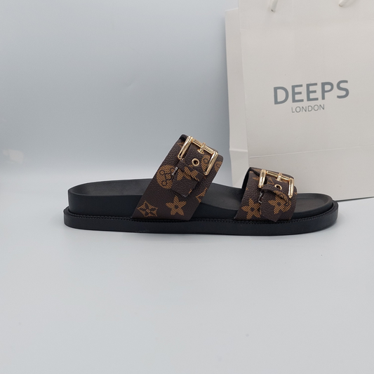 Front view of women's brown print flat slider sandals with double buckle straps