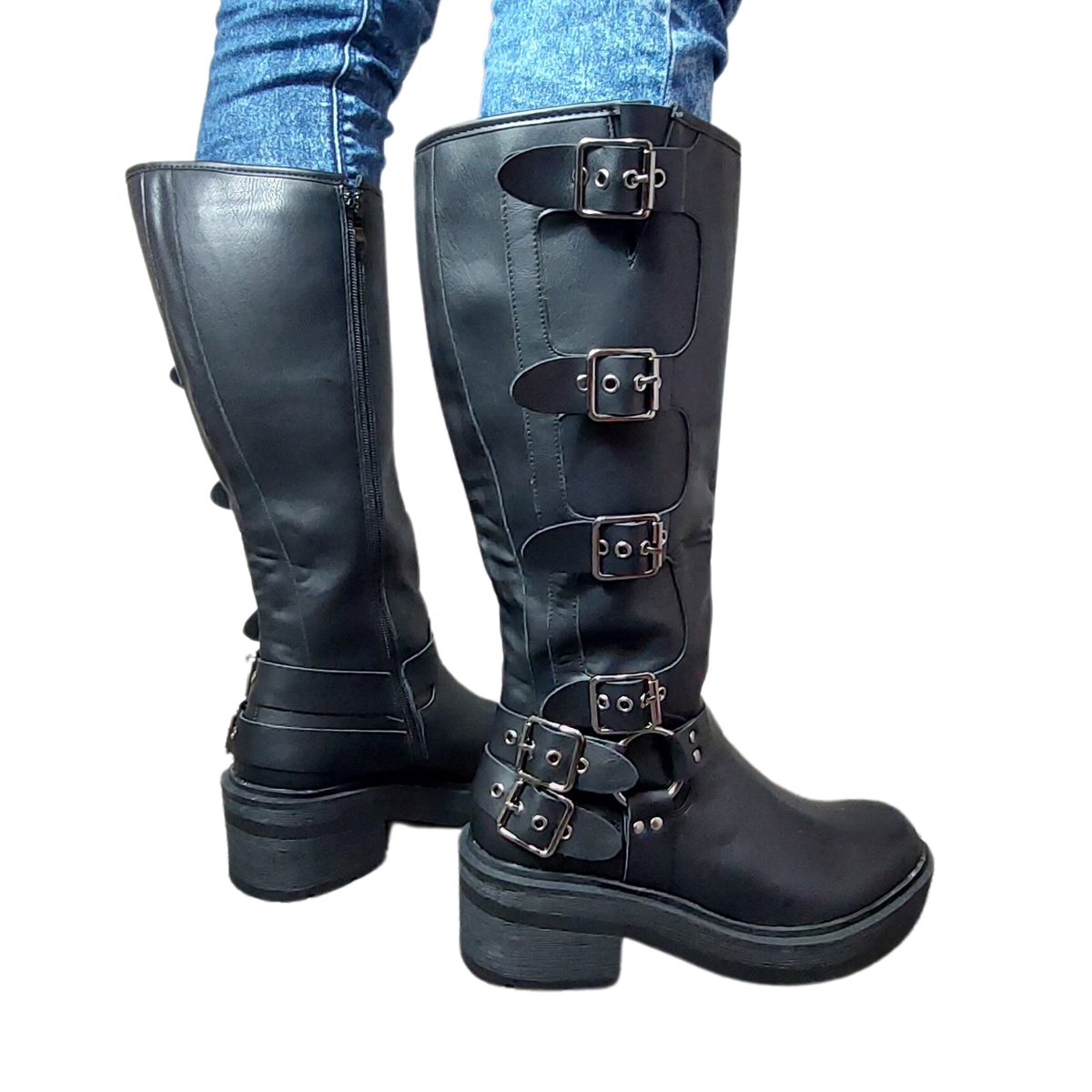 back of the buckle detailing and the faux leather texture on women's black mid-calf boots, highlighting their fashionable features in London.
