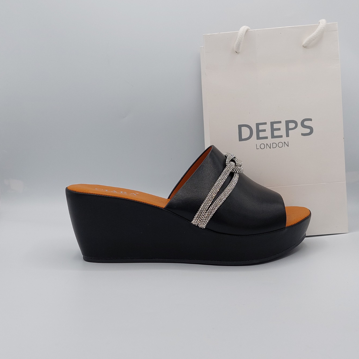 Side profile of Carey open toe diamante wedge platform mule slider sandal in black, highlighting the stylish wedge platform and sparkling strap design, London summer fashion from DeepsLondon.