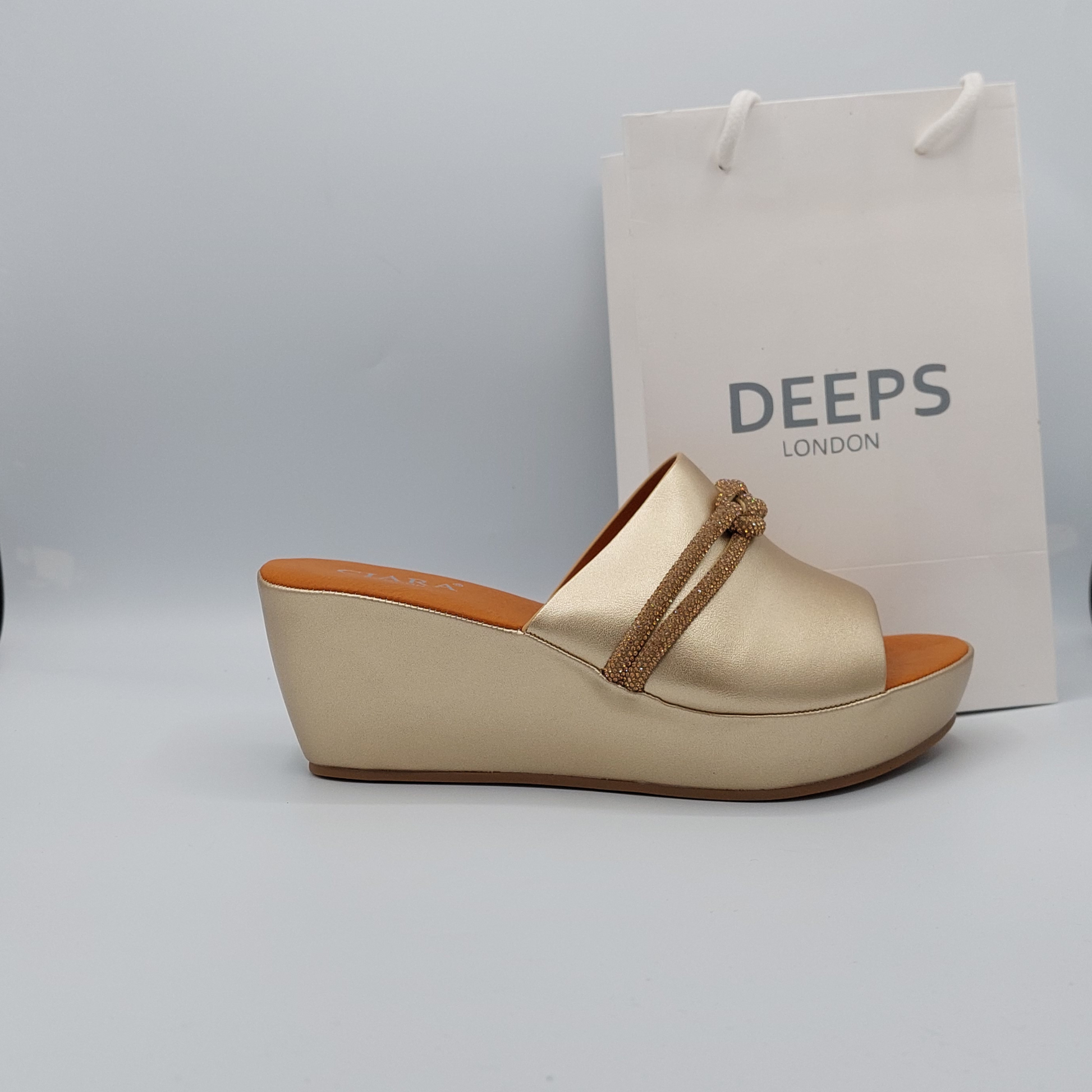 Side profile of Carey open toe diamante wedge platform mule slider sandal in gold, highlighting the stylish wedge platform and sparkling strap design, London summer fashion from DeepsLondon.