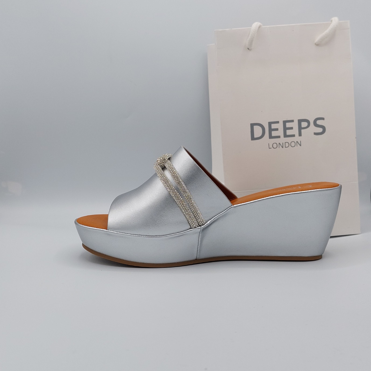 Close-up of the diamante embellishments on Carey wedge platform mules in silver, showcasing the exquisite sparkle and open toe, London summer footwear from DeepsLondon.