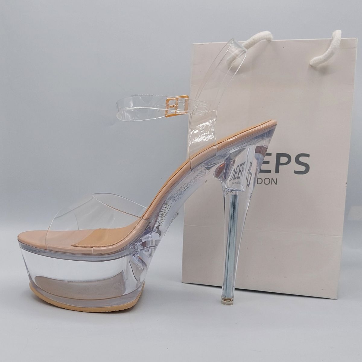 Close-up of the chunky clear platform and stiletto heel on women's high heels in nude, highlighting their modern and edgy design from DeepsLondon.