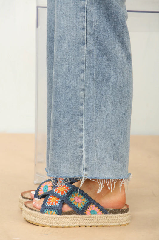 Side profile of crochet detail cross strap printed sandals in navy, highlighting the comfortable design and unique strap details, ideal for beach days.