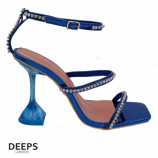 Front view of women's crystal embellished sandals with a pyramid heel and ankle tie in royal blue, glamorous London style from DeepsLondon.