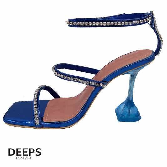 Side profile of women's crystal embellished sandals with a pyramid heel and ankle tie in royal blue, showcasing the pyramid heel and sparkling details for London fashion.