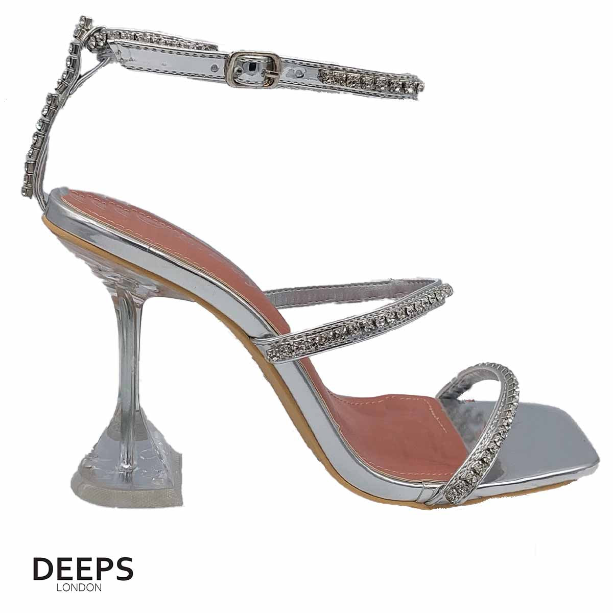 Front view of women's crystal embellished sandals with a pyramid heel and ankle tie in silver, glamorous London style from DeepsLondon.