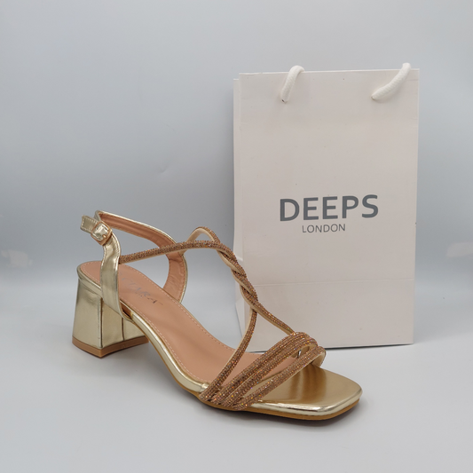 Side profile of Deeps London gold diamante embellished block heel sandals, showcasing the block heel and strap detailing.
