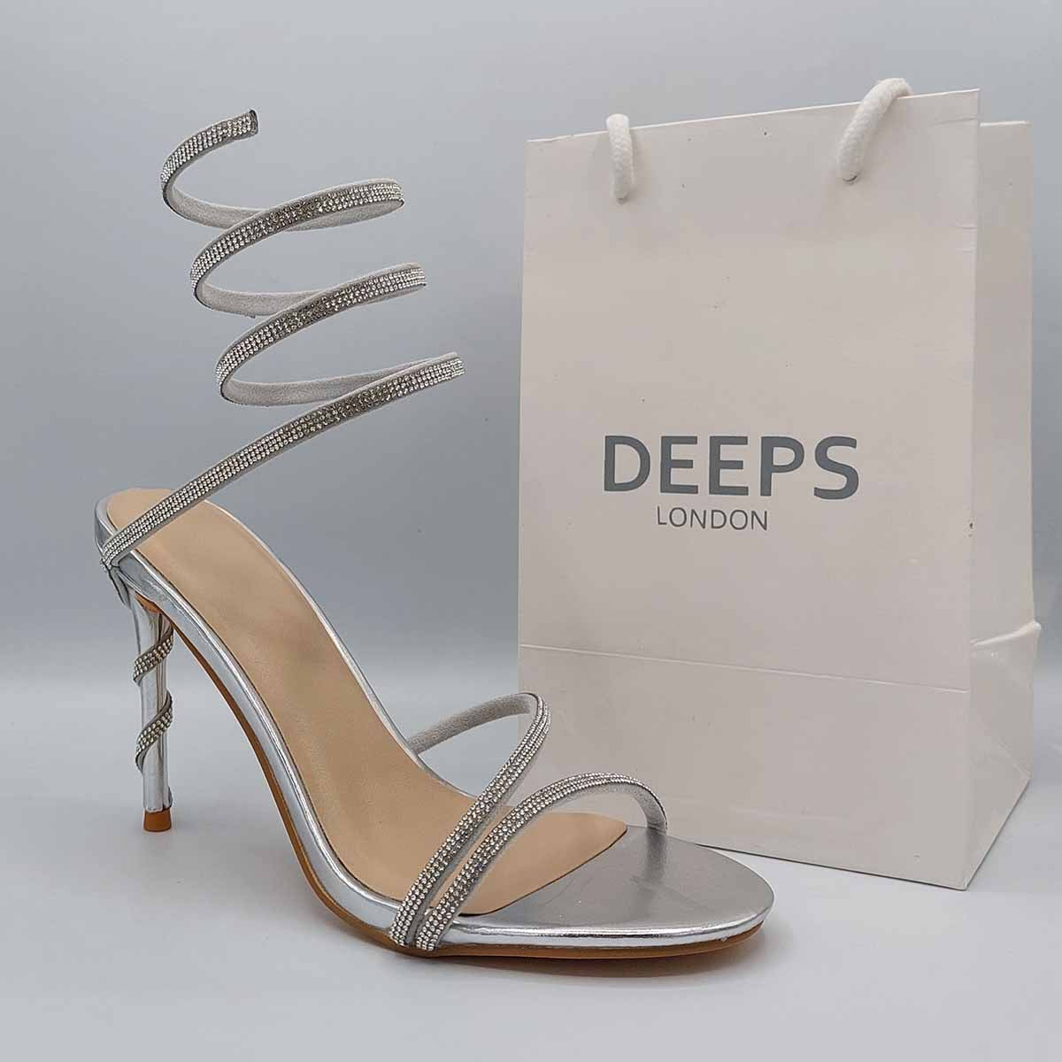 Front view of diamante spiral wrap around stiletto heels in silver, glamorous women's occasion sandals in London from DeepsLondon.