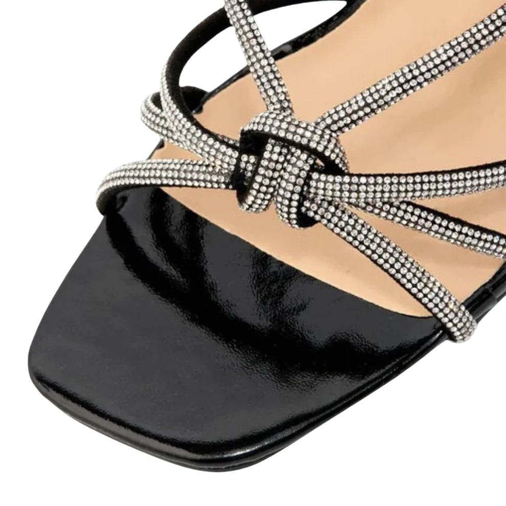 Close-up of the diamante embellishments on the straps of women's stiletto heel sandals in black, highlighting their elegant features from DeepsLondon.
