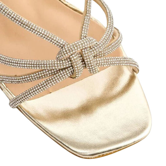 Close-up of the diamante embellishments on the straps of women's stiletto heel sandals in gold, highlighting their elegant features from DeepsLondon