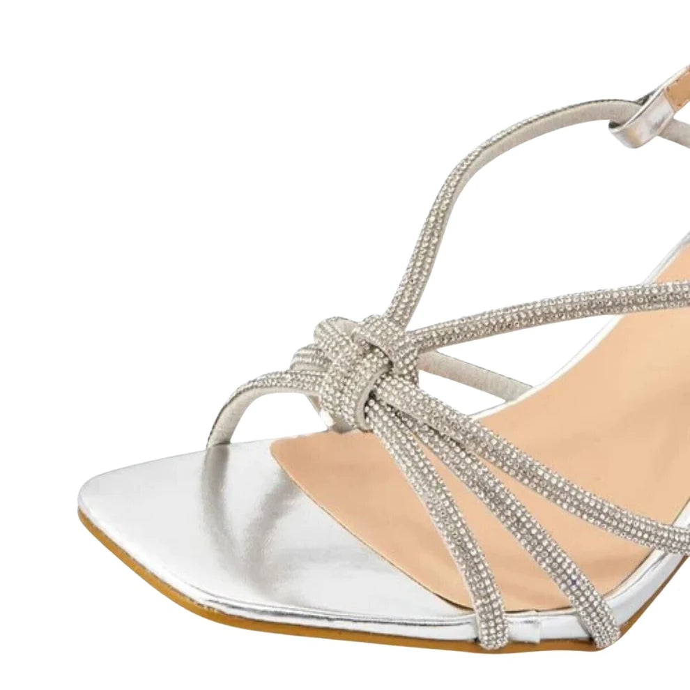 Woman's foot wearing stylish diamante strap stiletto heel sandals in silver, a comfortable and fashionable choice for London events from DeepsLondon.