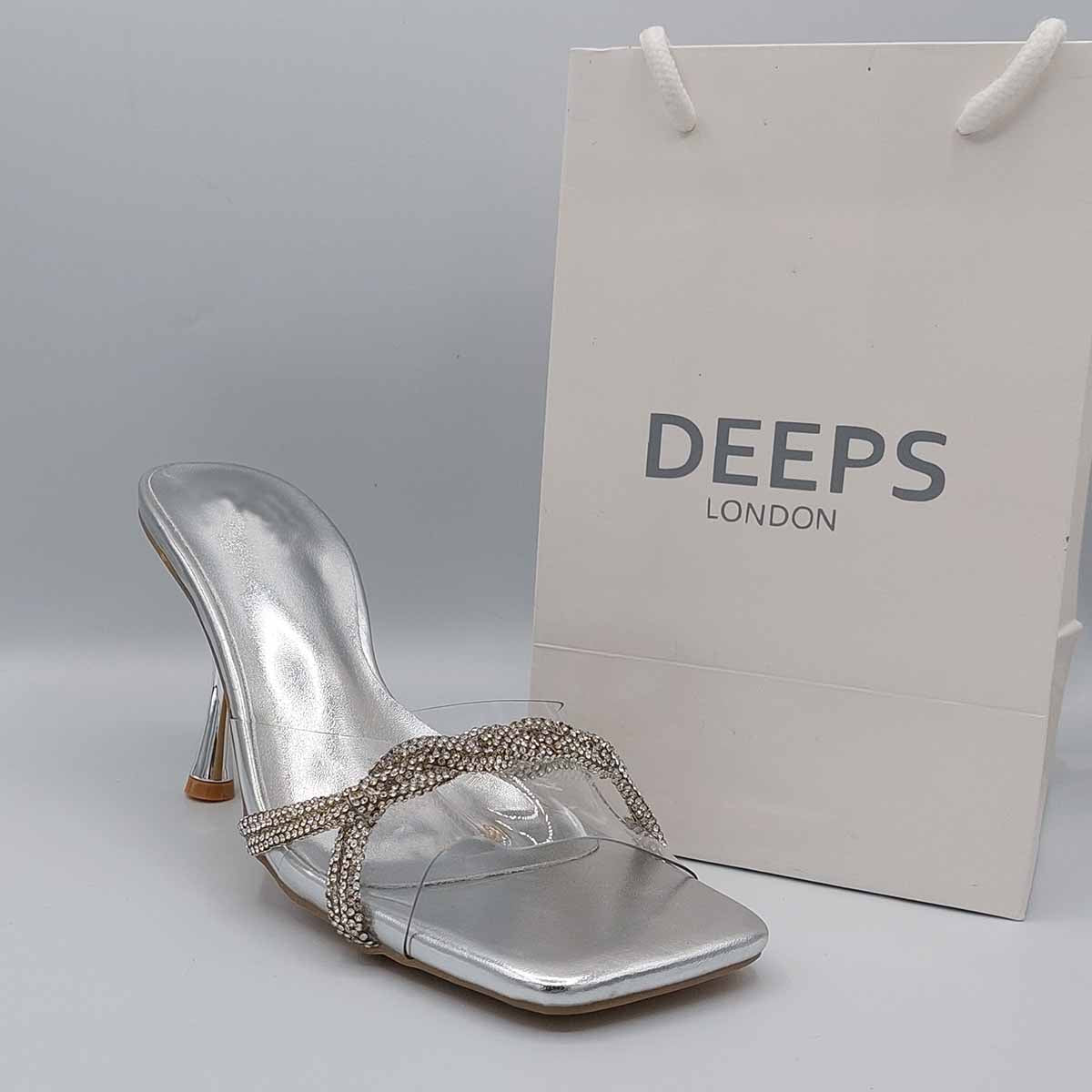 Side profile of women's diamante strappy mule sandals in silver, showcasing the elegant straps and sparkling diamante detailing for London fashion.