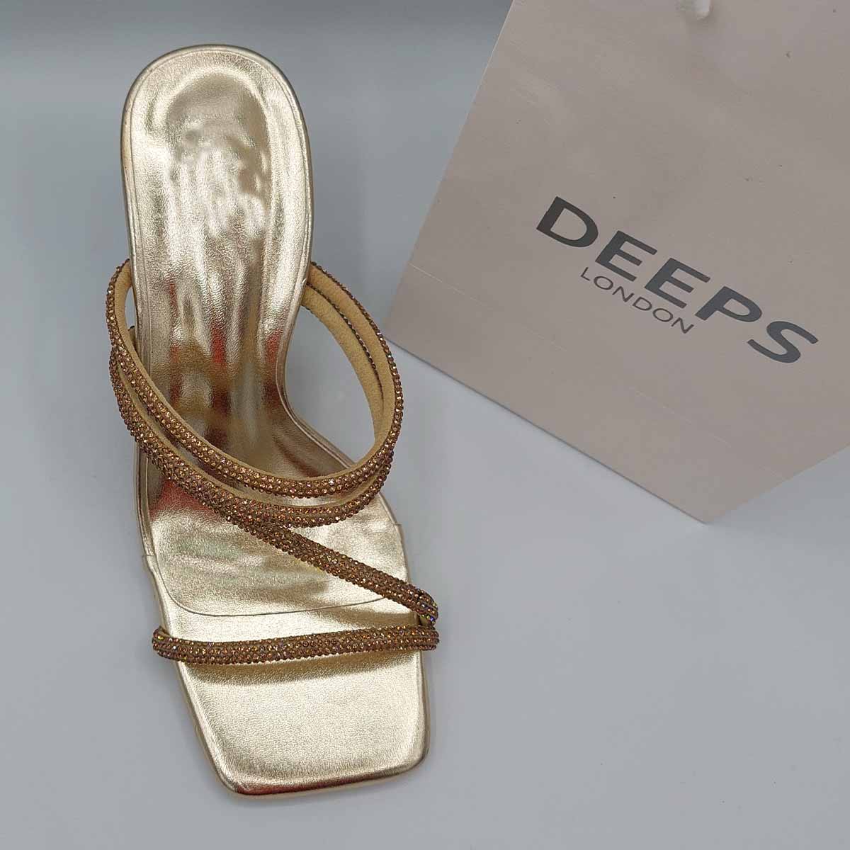 Close-up of the intricate diamante strap design and square toe on women's mule sandals in gold, highlighting their luxurious and modern features from DeepsLondon.