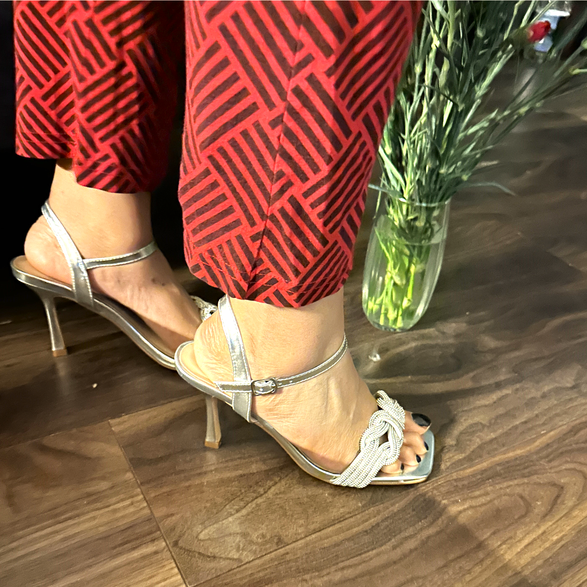 Close-up of the diamante embellishments on the toe strap of women's heeled sandals in silver, highlighting their elegant features from DeepsLondon.
