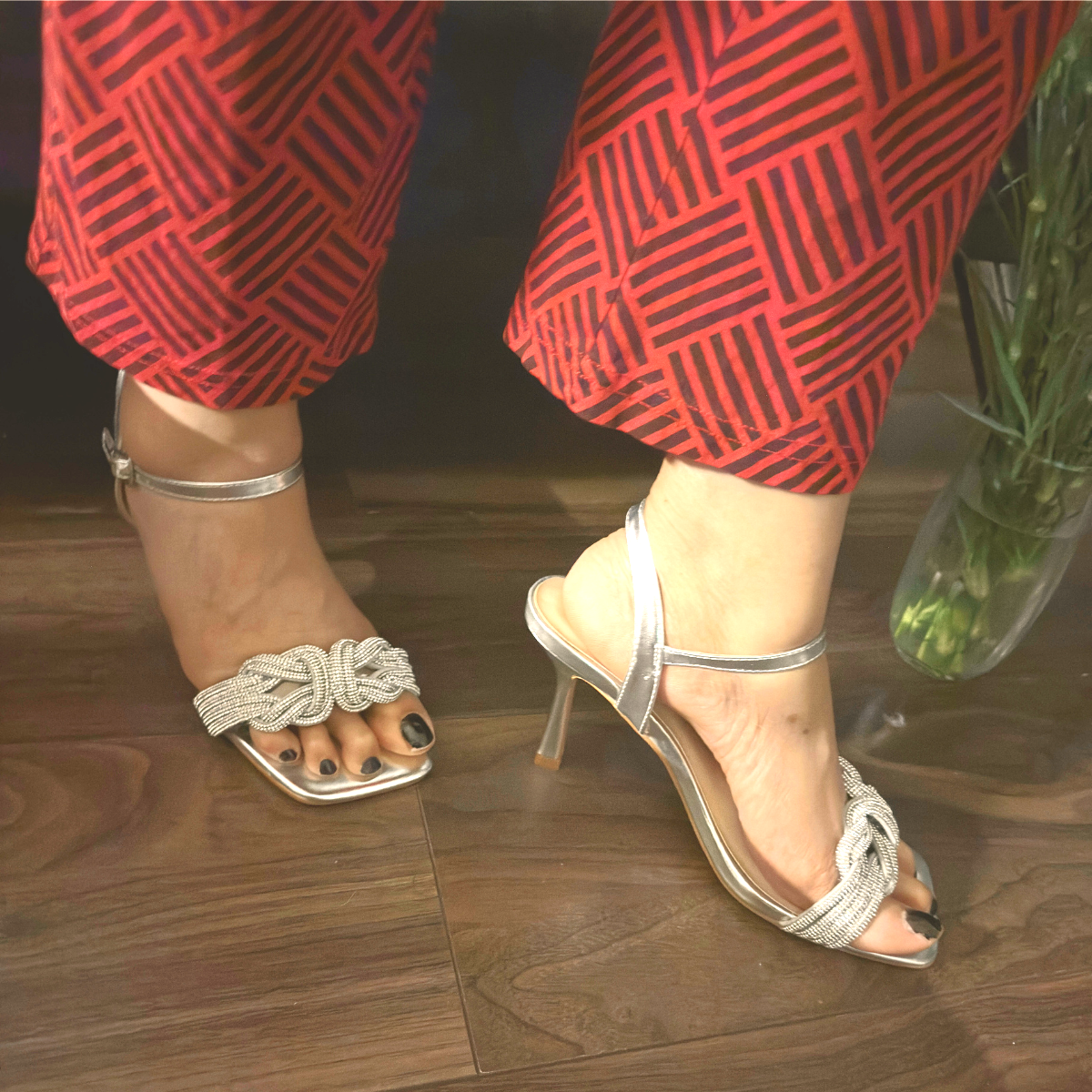 Woman's foot wearing stylish diamante toe heeled sandals in silver, a comfortable and fashionable choice for London events from DeepsLondon.