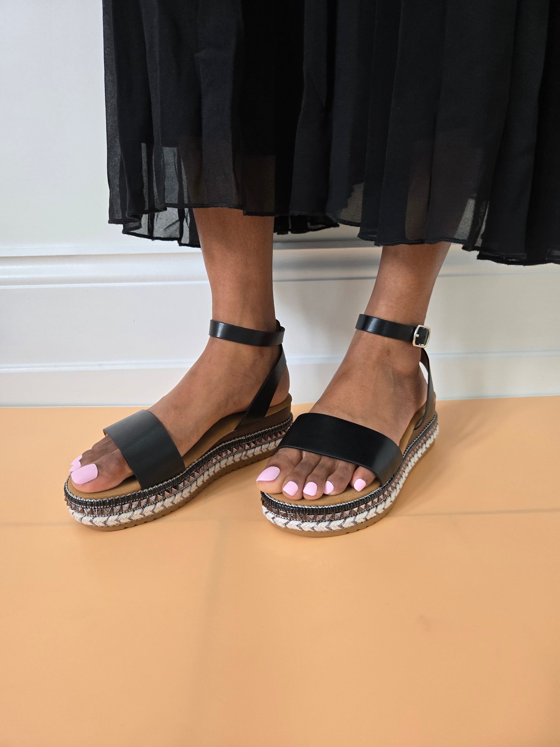 Side view of women's espadrille flatform sandals in black showcasing the wedge and strap details, stylish summer footwear from DeepsLondon in London.