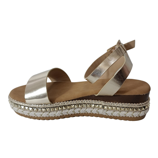 Side view of women's espadrille flatform sandals in gold showcasing the wedge and strap details, stylish summer footwear from DeepsLondon in London.