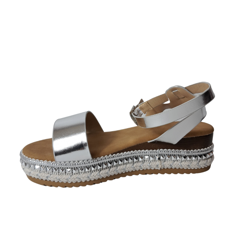 Side view of women's espadrille flatform sandals in silver showcasing the wedge and strap details, stylish summer footwear from DeepsLondon in London.