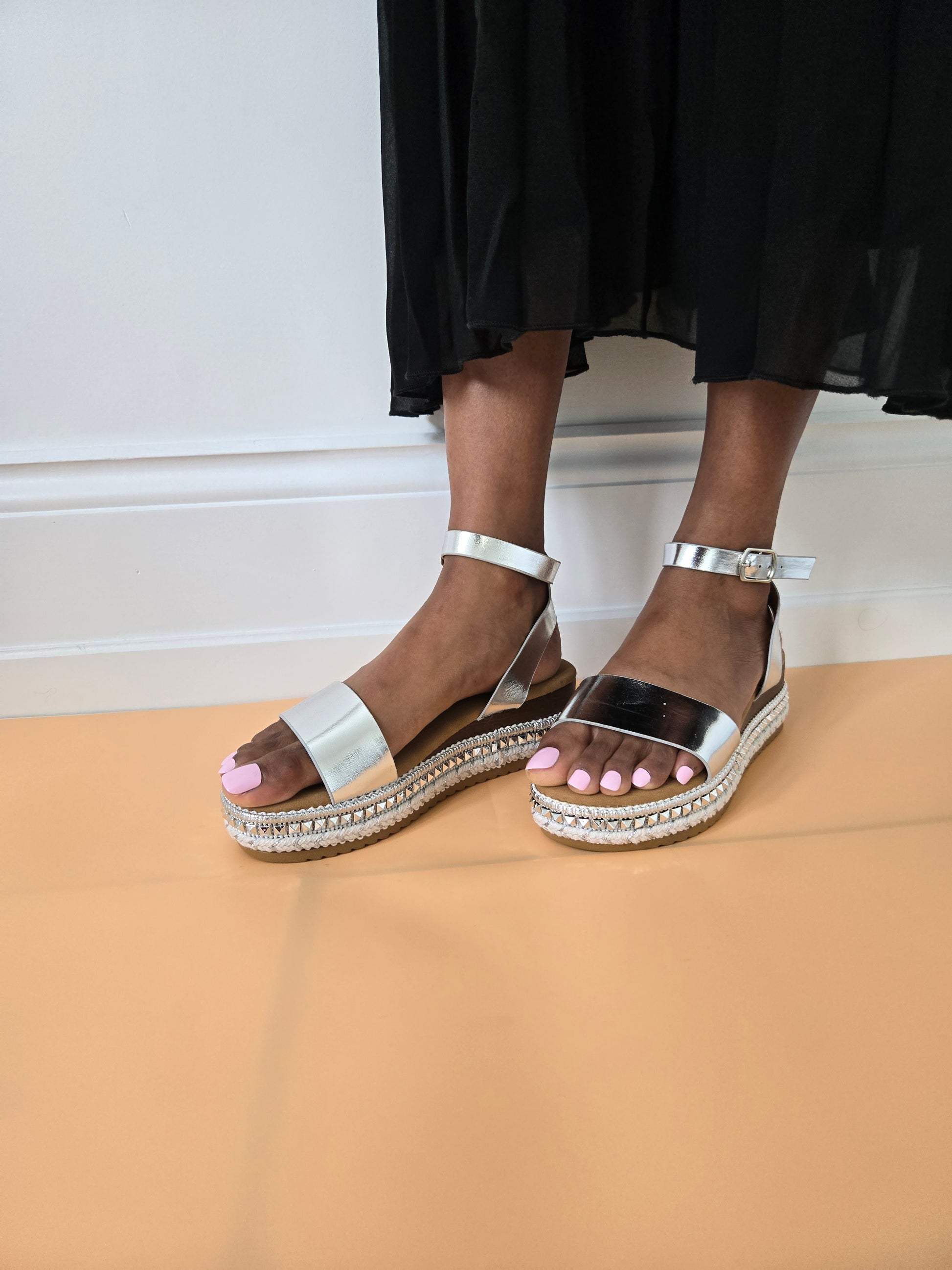 Side view of women's espadrille flatform sandals in silver showcasing the wedge and strap details, stylish summer footwear from DeepsLondon in London.