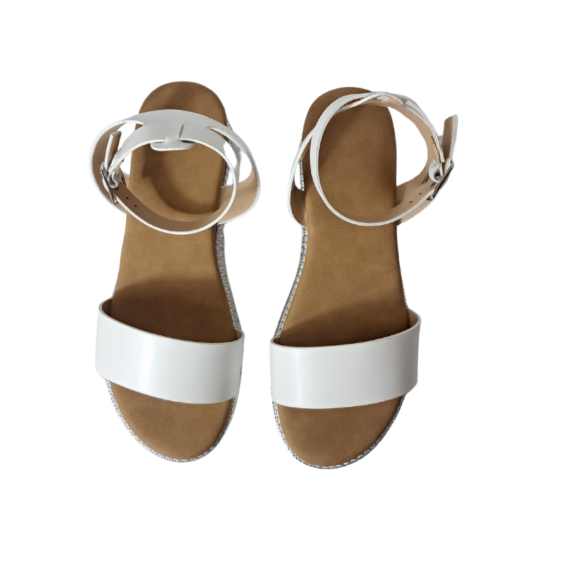 Woman's foot wearing stylish women's espadrille flatform sandals in white, comfortable summer wedges from DeepsLondon in London.