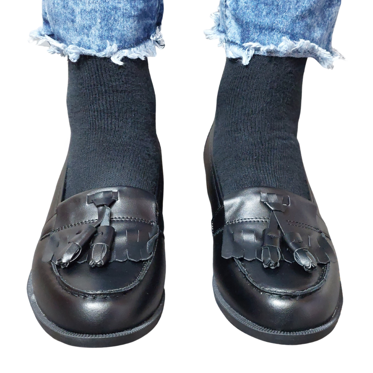 Close-up of the fringe and tassel detailing on women's black pu loafers, highlighting their elegant design in London.