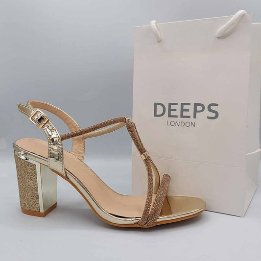 Side profile of women's glitter block heel sandals with diamante detail in gold, showcasing the block heel and strap detailing for London fashion.