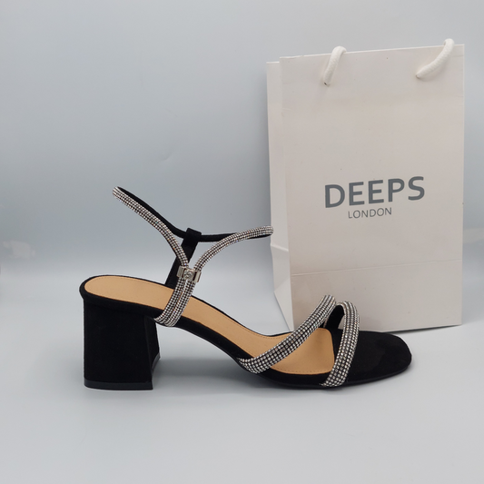 Front view of women's glitter block heel sandal in black with diamante front straps and buckle ankle strap, a glamorous choice from DeepsLondon.