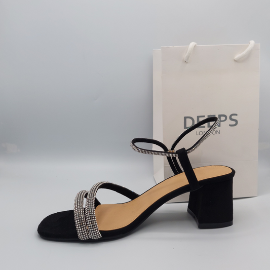 Side profile of women's glitter block heel sandal in black, showcasing the block heel and diamante strap detailing.