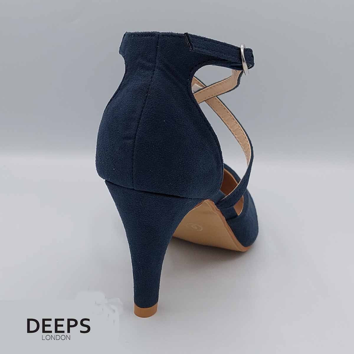 Close-up of the knitted heel and strap design on women's low court shoes in navy, highlighting their elegant features suitable for parties and weddings in London.
