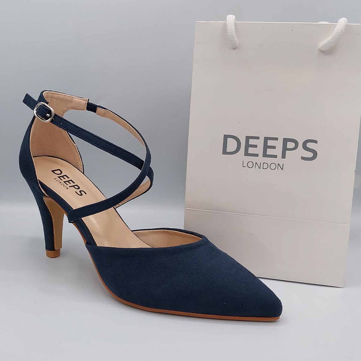 Woman's foot wearing stylish low knitted heel strappy court shoes in navy, a comfortable and fashionable choice for London parties and bridal events from DeepsLondon.