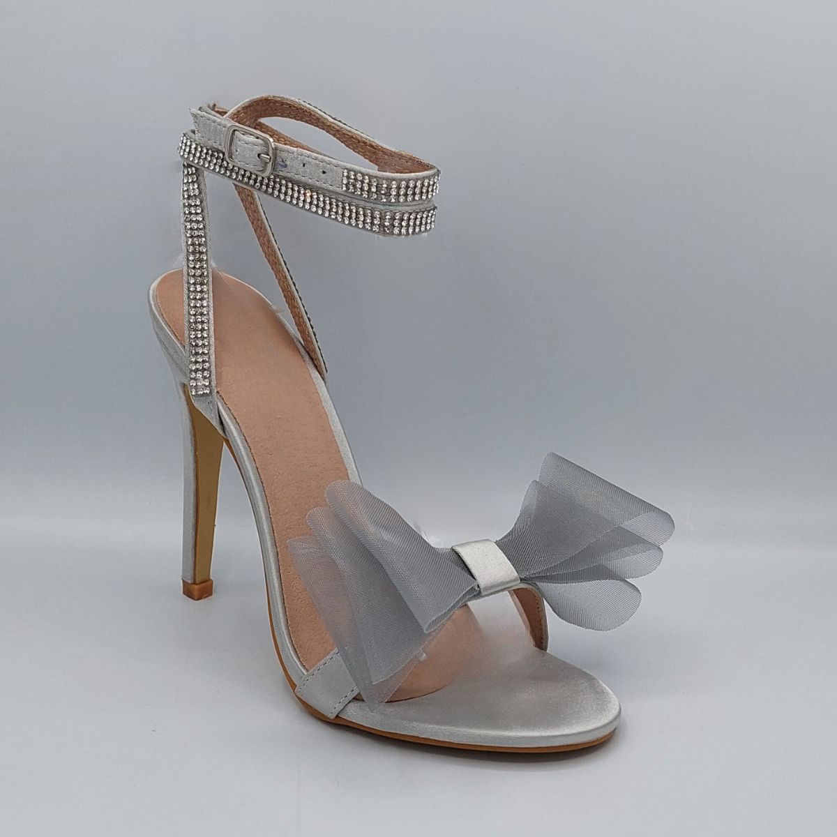 Front view of Majesty organza bow high heel sandals in silver satin, showcasing the elegant high heel and delicate organza bow, London style from DeepsLondon.