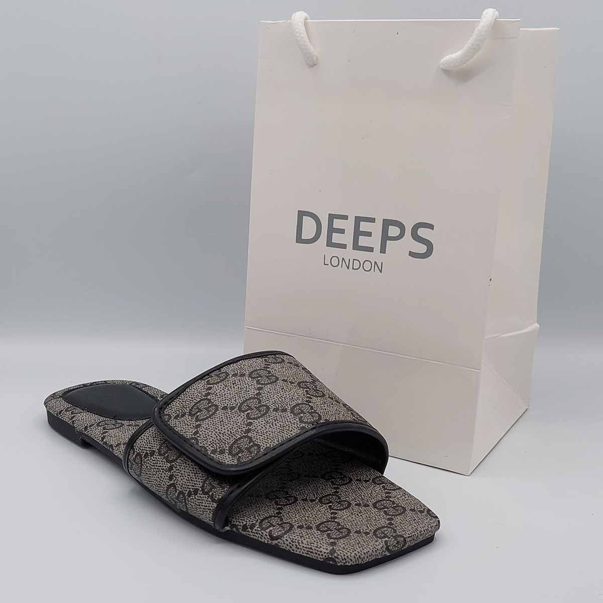 Close-up of the black print pattern on women's open toe flat slider sandals, highlighting their trendy design for London style.