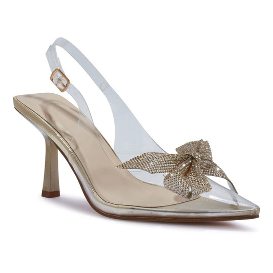 Front view of women's perspex court shoe with diamante brooch detail in gold, an elegant and stylish choice for London occasions.