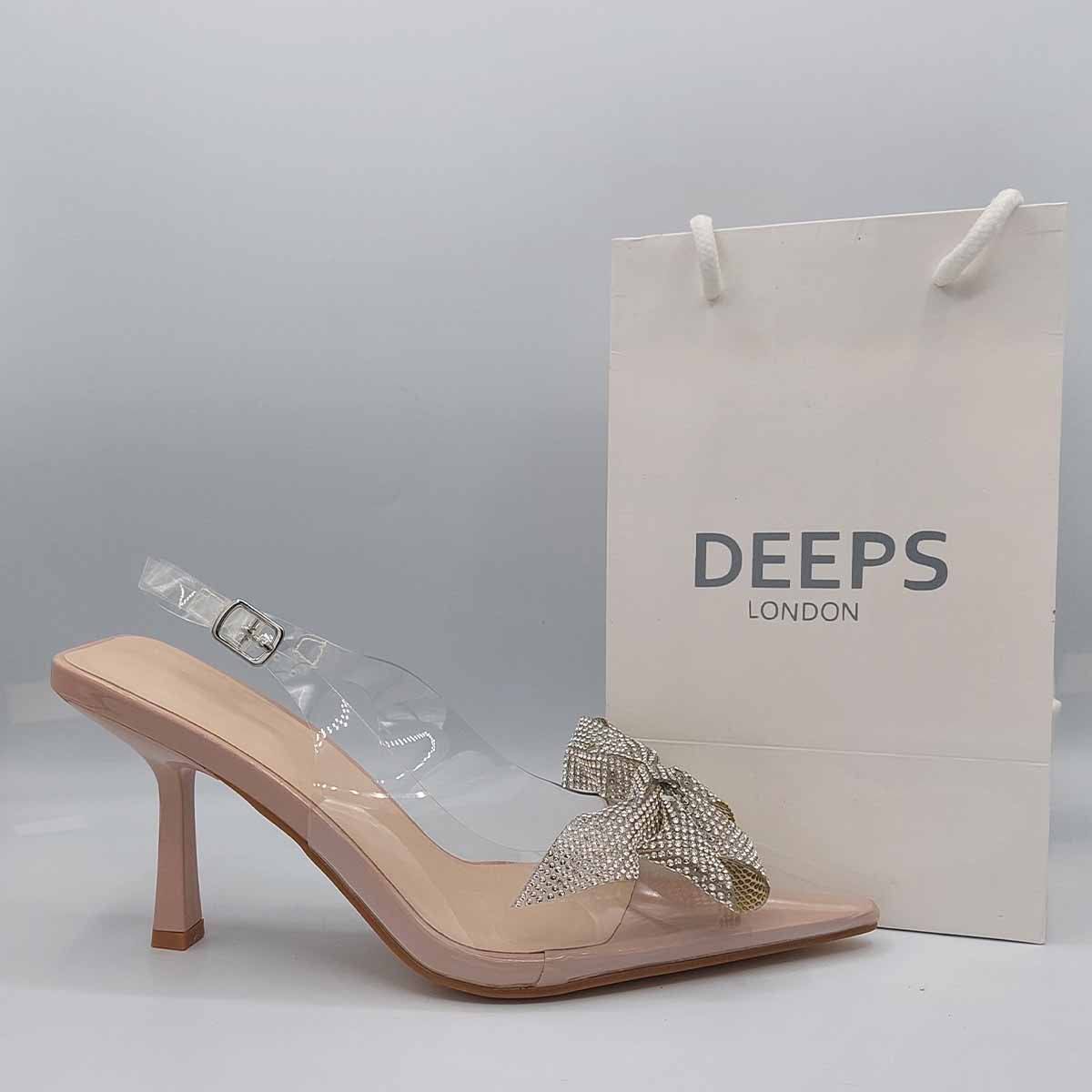 Side profile of women's perspex court shoe with diamante brooch detail in nude, showcasing the perspex material and brooch detailing.