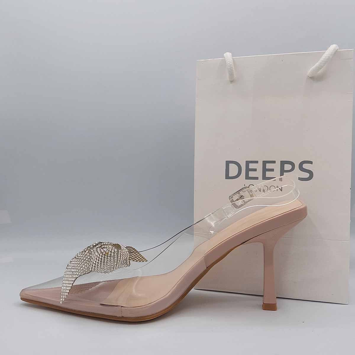 Close-up of the diamante brooch detail on women's perspex court shoe in silver, highlighting its elegant and sparkling features.