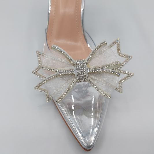 Side profile of women's perspex court shoe with diamante brooch detail in silver, showcasing the perspex material and brooch detailing.