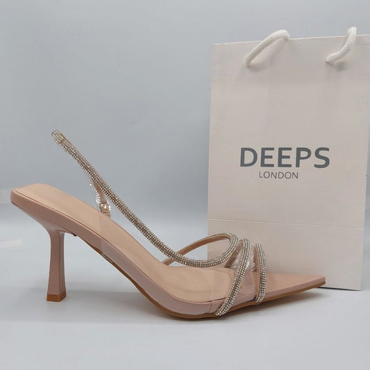 Side profile of women's clear perspex slingback stiletto heels, showcasing the high stiletto heel and rhinestone detailing for London fashion.
