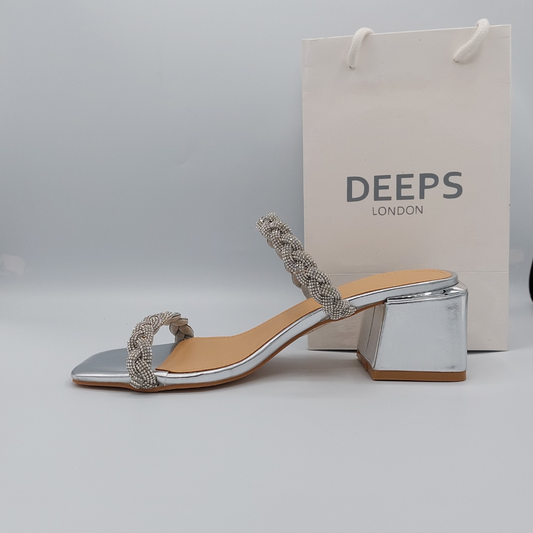 Close-up of the silver plaited strap and gemstone detailing on Deeps London block heel mule, highlighting their elegant and sparkling features.