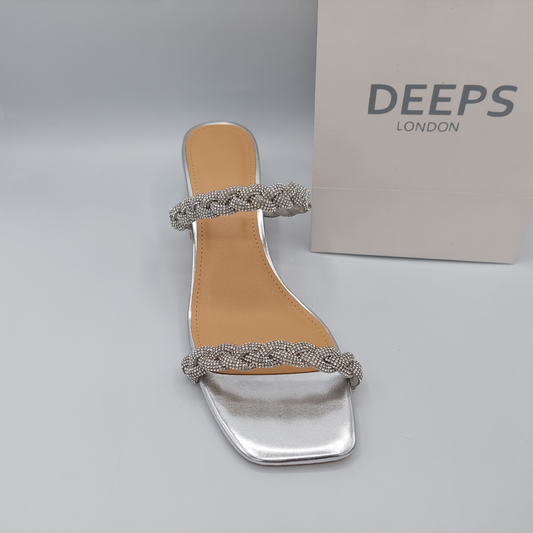 Front view of Deeps London silver plaited gemstone band block heel mule, an elegant and stylish choice for London occasions.