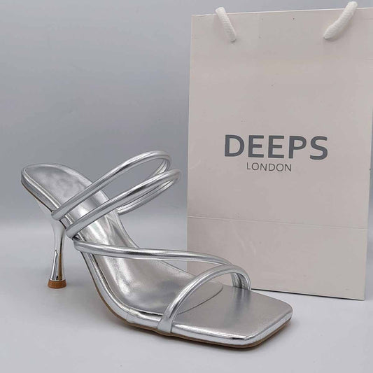 Front view of women's strappy mule sandals in silver, a stylish and easy-to-wear choice for London occasions from DeepsLondon.