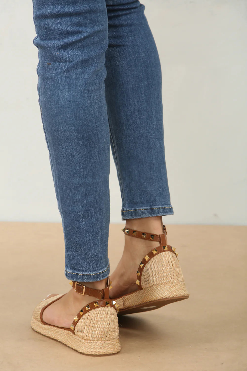 Back profile of the stud details and raffia texture on studded ankle strap sandals in tan, showcasing the unique embellishments, London boho-chic footwear from DeepsLondon.