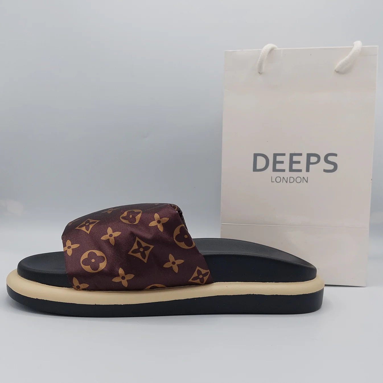 Side profile of women's velcro strap flatform slider sandal in brown, highlighting the supportive flatform and easy slip-on design.